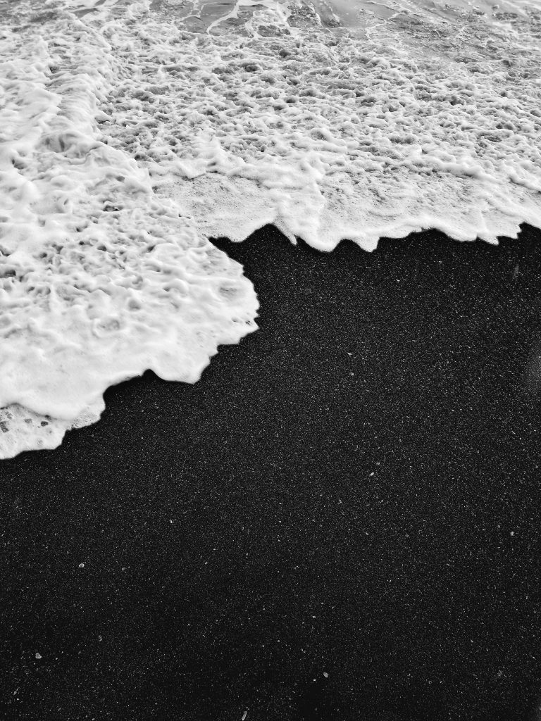 a beach with black sand